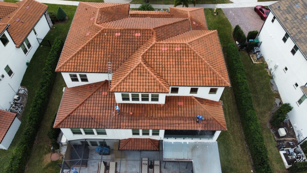 Aerial drone view of home with pool enclosure in Central Florida