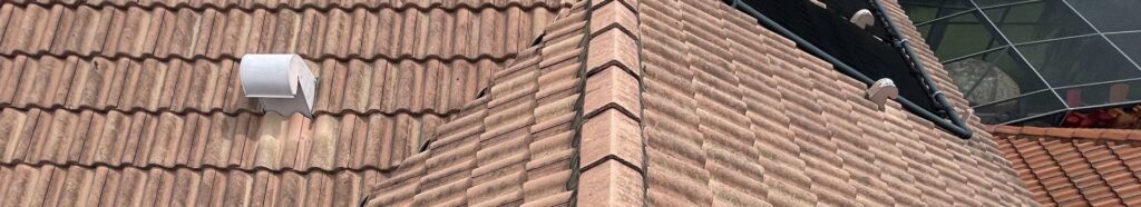 Close-up detail of sealed clay tile roof with ridge tiles in Central Florida