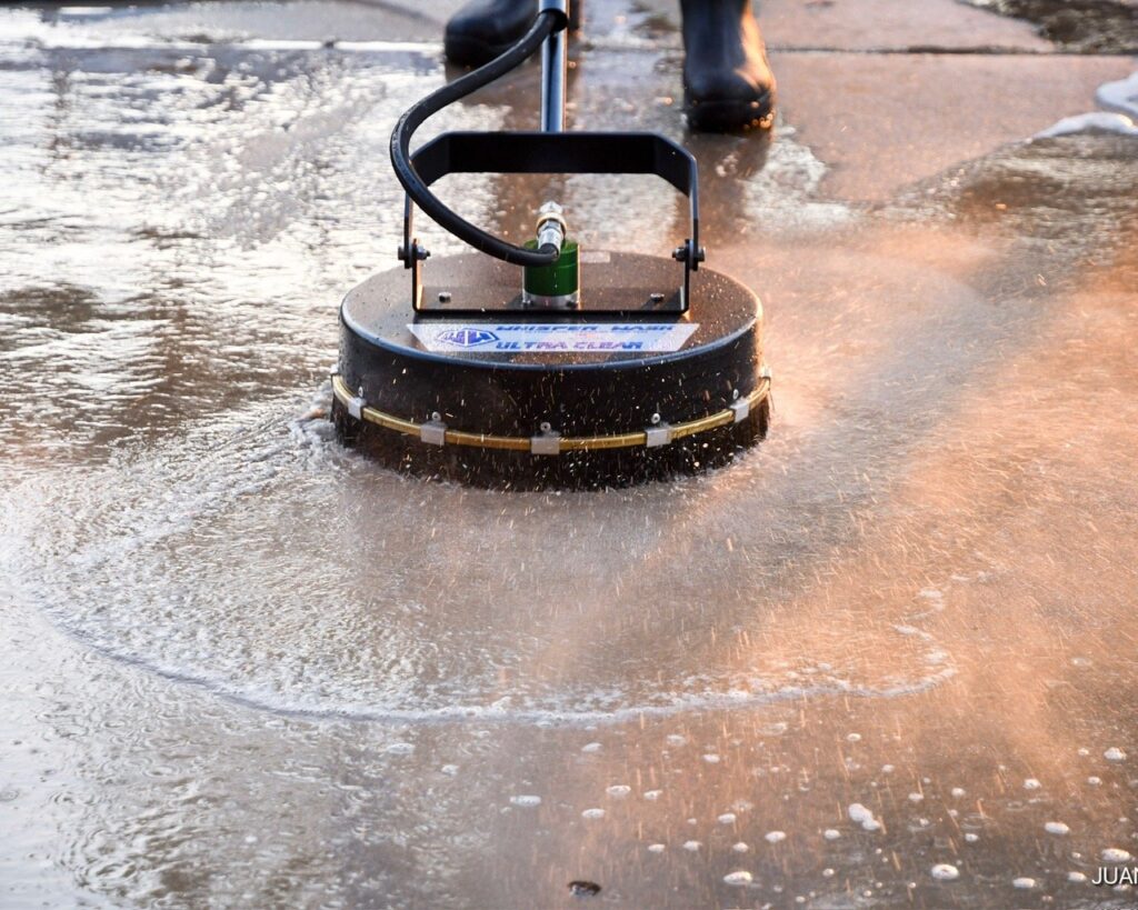 Surface cleaner attachment pressure washing wet concrete in Orlando FL